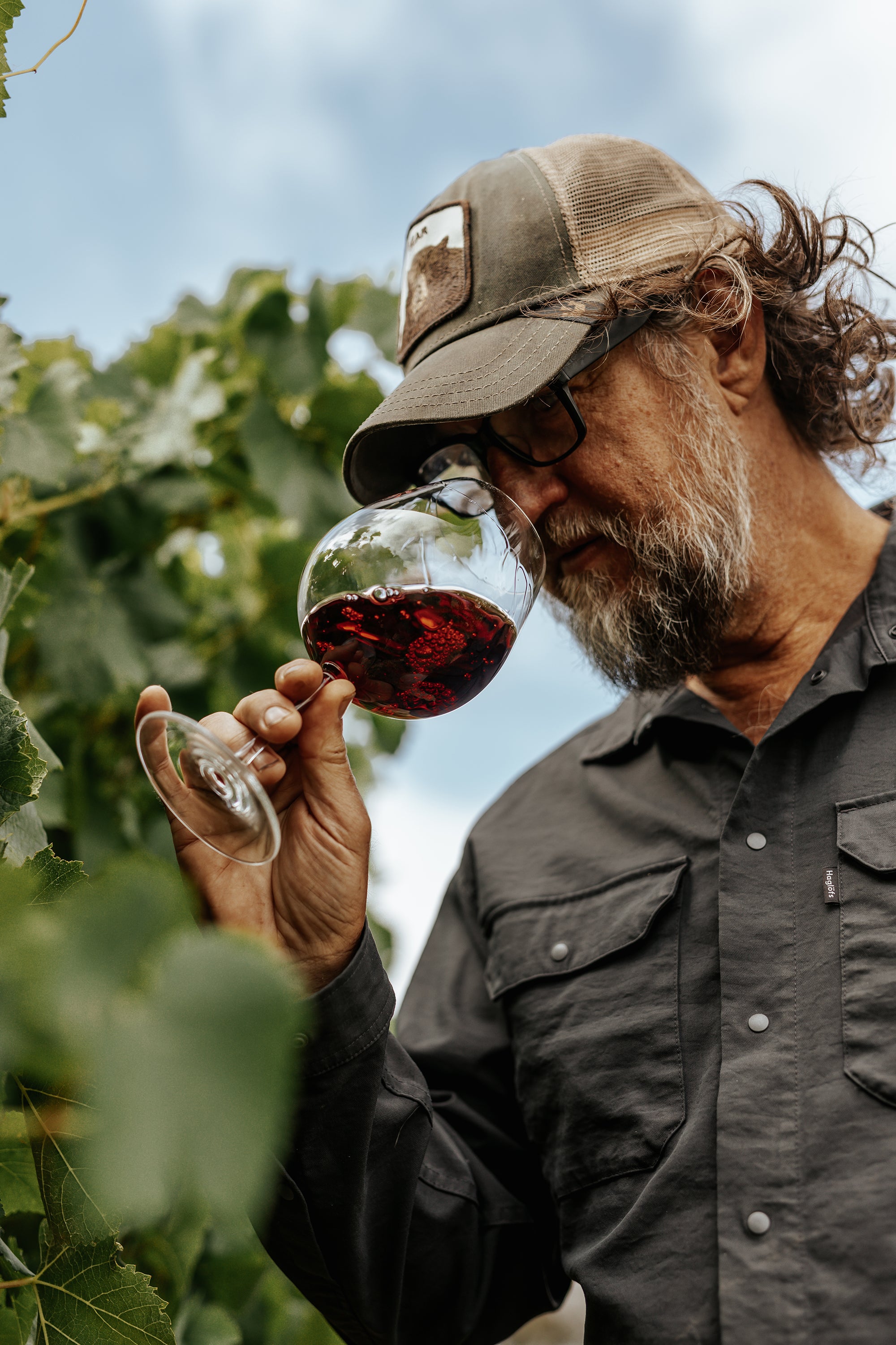 Man smelling wine